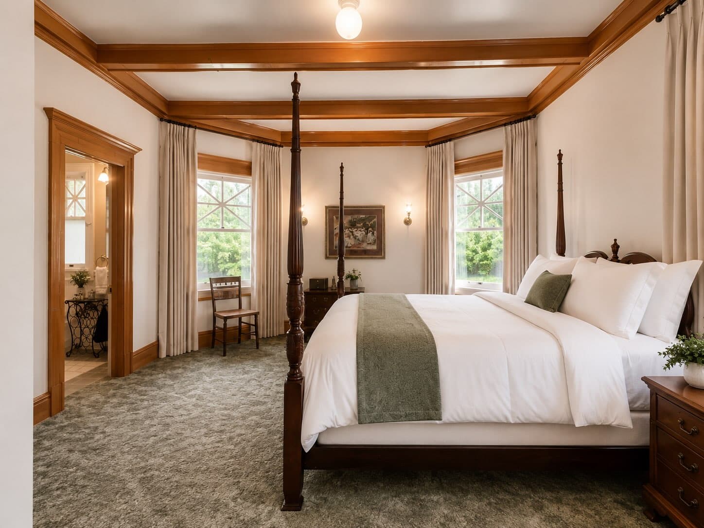 A stylish bedroom featuring a four-poster bed, warm wood accents, and large windows.